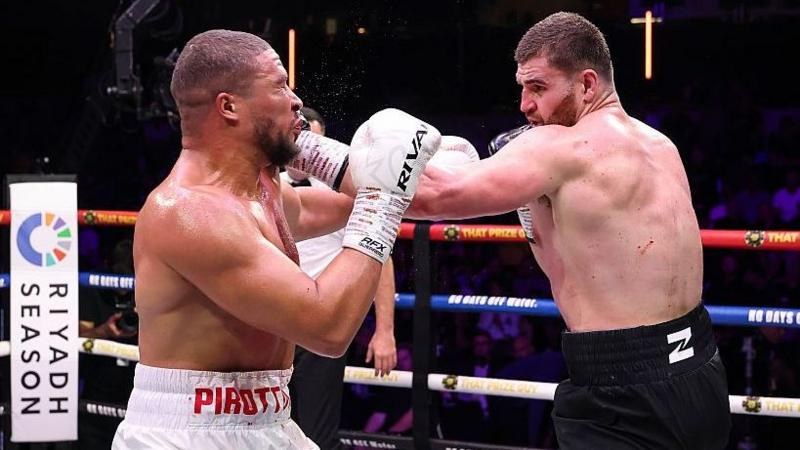 Johnny Fisher lands a punch on Michael Pirotton